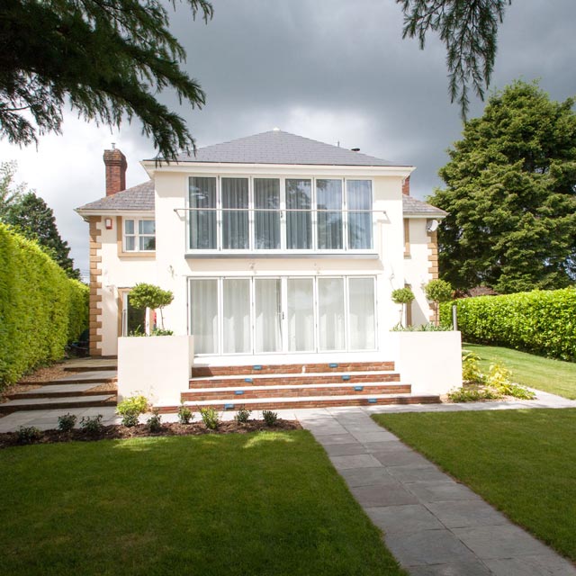 House in Nailsea, near Bristol, Somerset, showing new extension and contemporary terrace